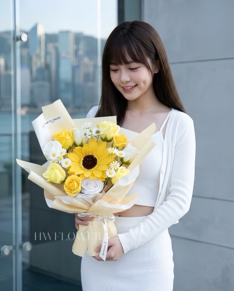 HW FLOWER yellow sunflower soap flower bouquet with yellow and white roses and daisies, wrapped in cream paper, ideal for Hong Kong graduation gifts.